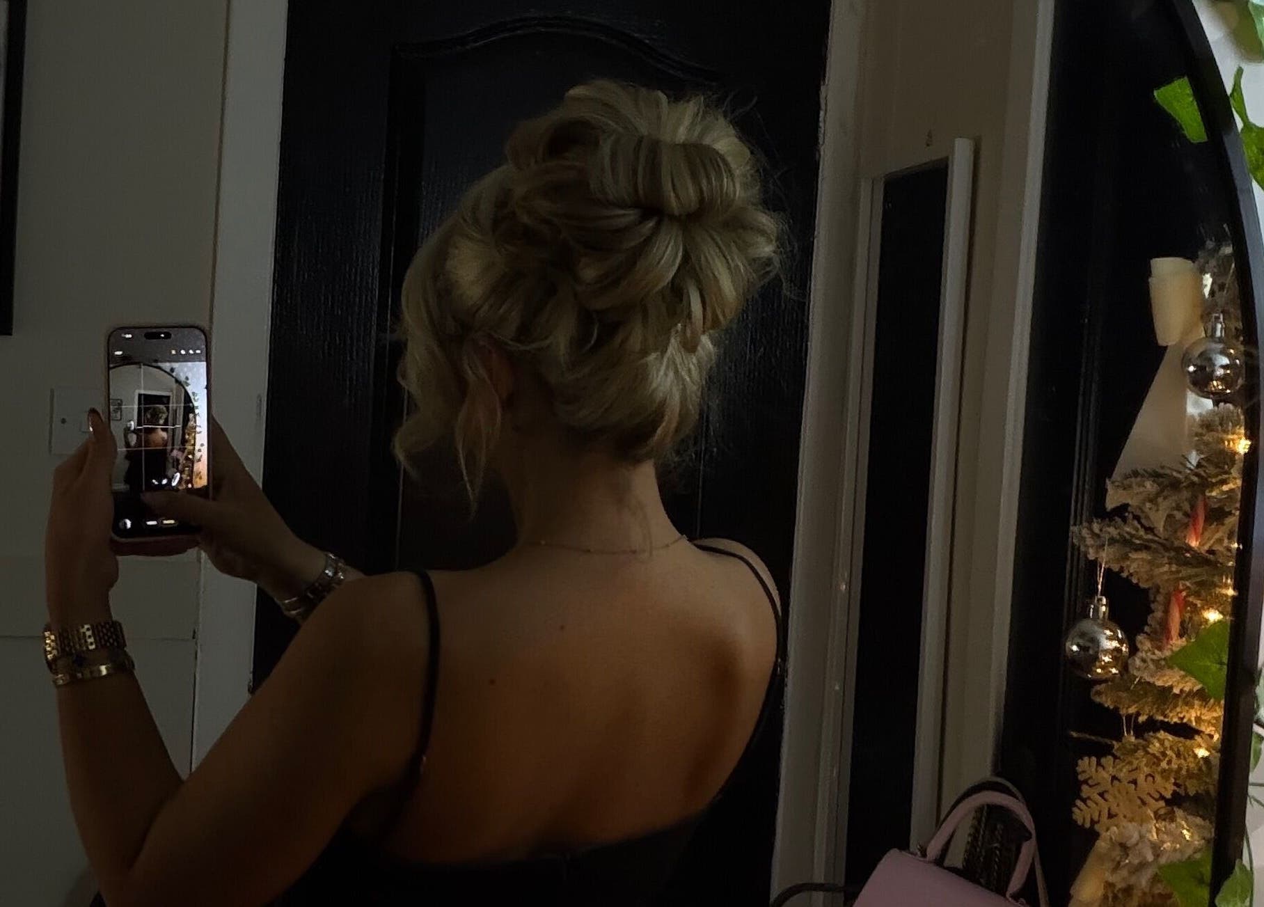 Blonde elegant updo reflected in mirror at Hair by JC, Kilwinning, Scotland, GB. Captured via smartphone.