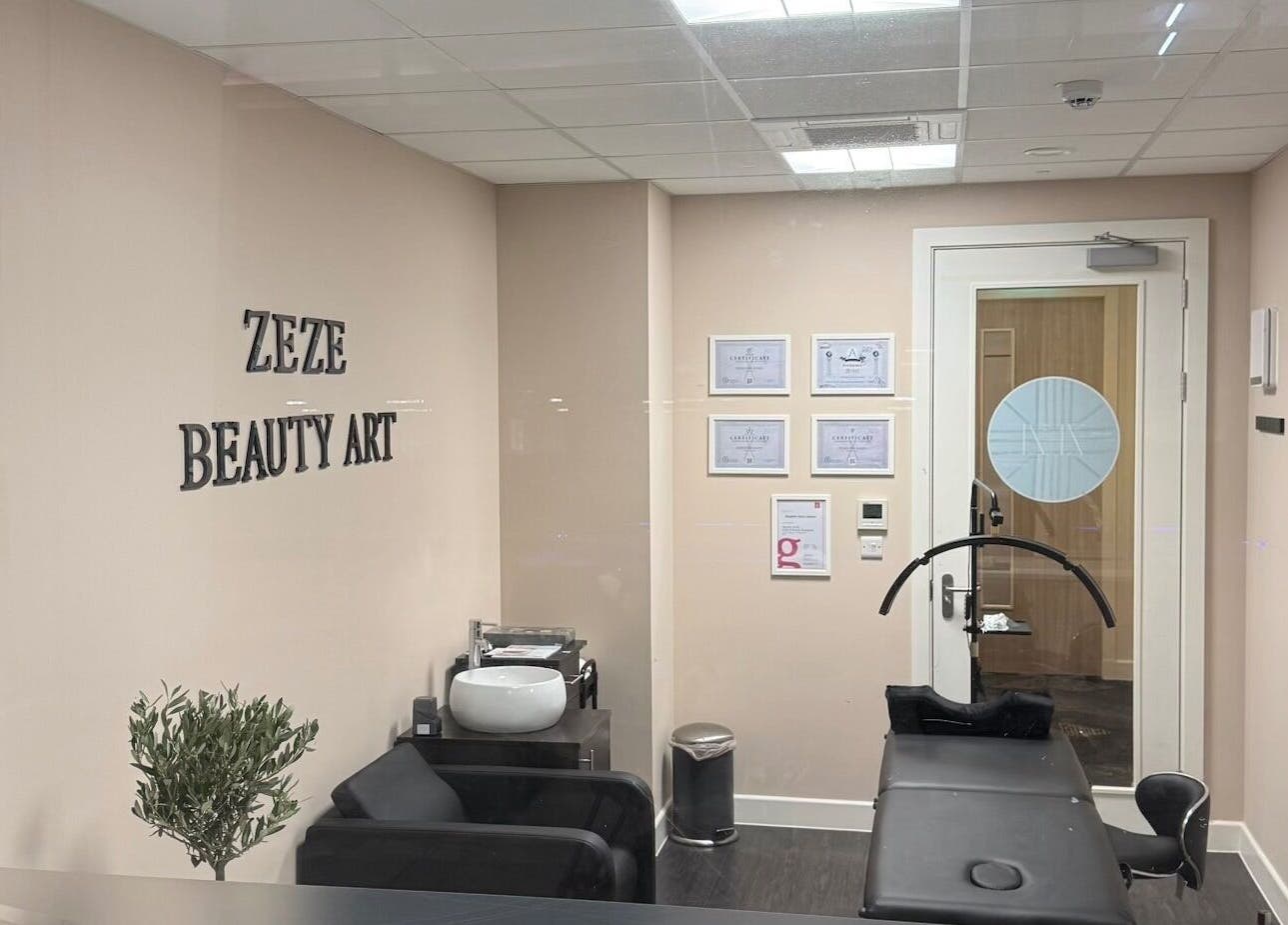 Interior of ZeZe Beauty Art salon in Birmingham, England, GB showcasing sleek design and modern equipment.