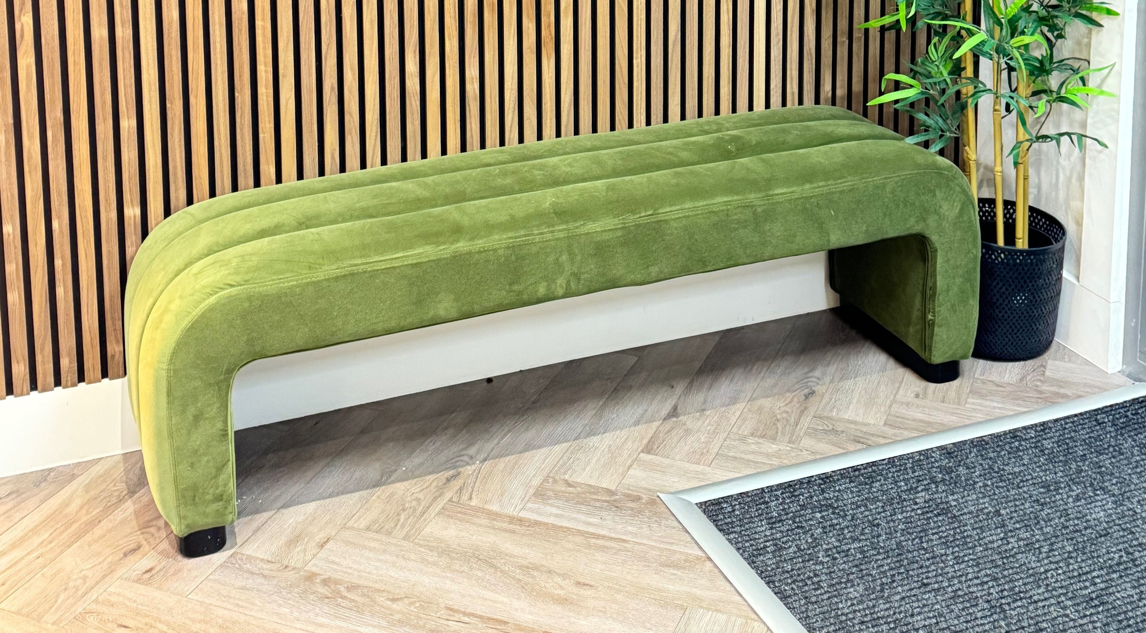 Elegant green bench at Elya Aesthetic, London, England, GB, enhancing the wellness ambience.