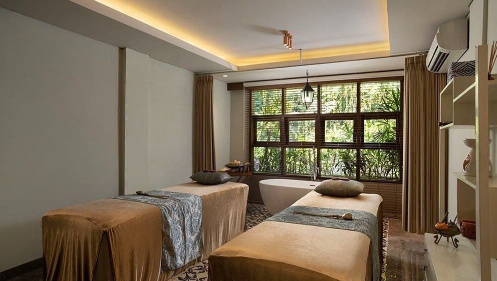 Relaxing treatment room at Tejas Spa Bisma, Bali, Bali, ID with two massage tables and a serene ambiance.