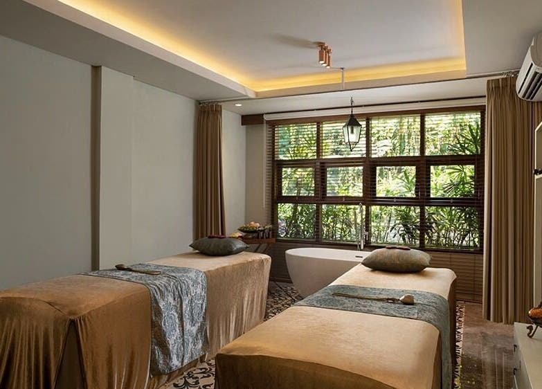 Relaxing treatment room at Tejas Spa Bisma, Bali, Bali, ID with two massage tables and a serene ambiance.