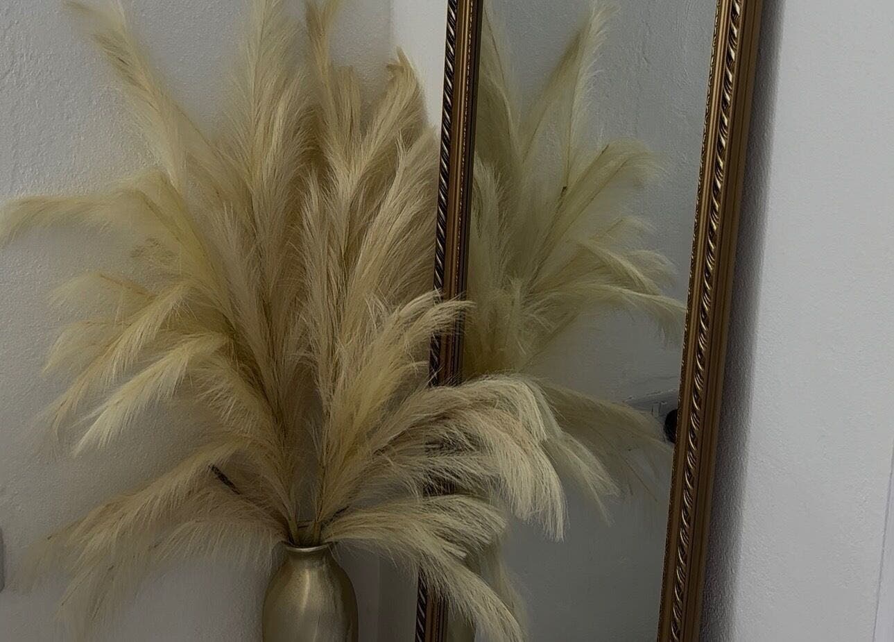 Decorative pampas grass near a gold mirror at Pretty Reflections, Gros Islet, Gros Islet, LC.