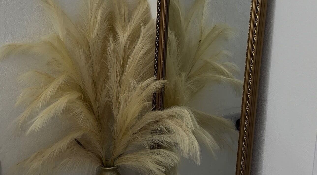 Decorative pampas grass near a gold mirror at Pretty Reflections, Gros Islet, Gros Islet, LC.
