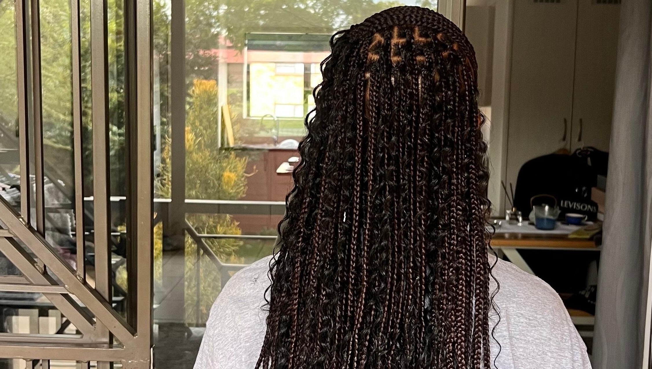 Intricate braided hairstyle at Hairdressers of the North, Roodepoort, Gauteng, ZA.