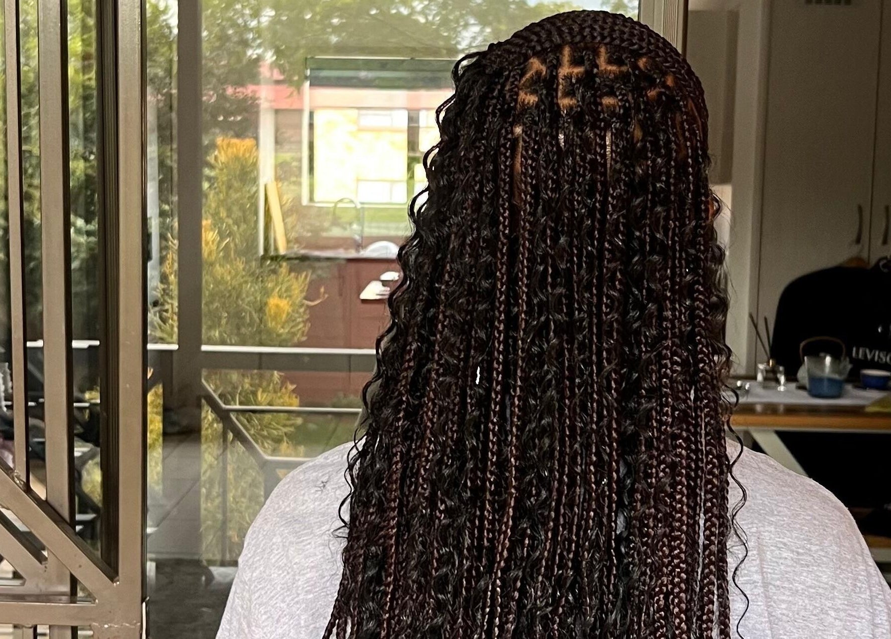 Intricate braided hairstyle at Hairdressers of the North, Roodepoort, Gauteng, ZA.