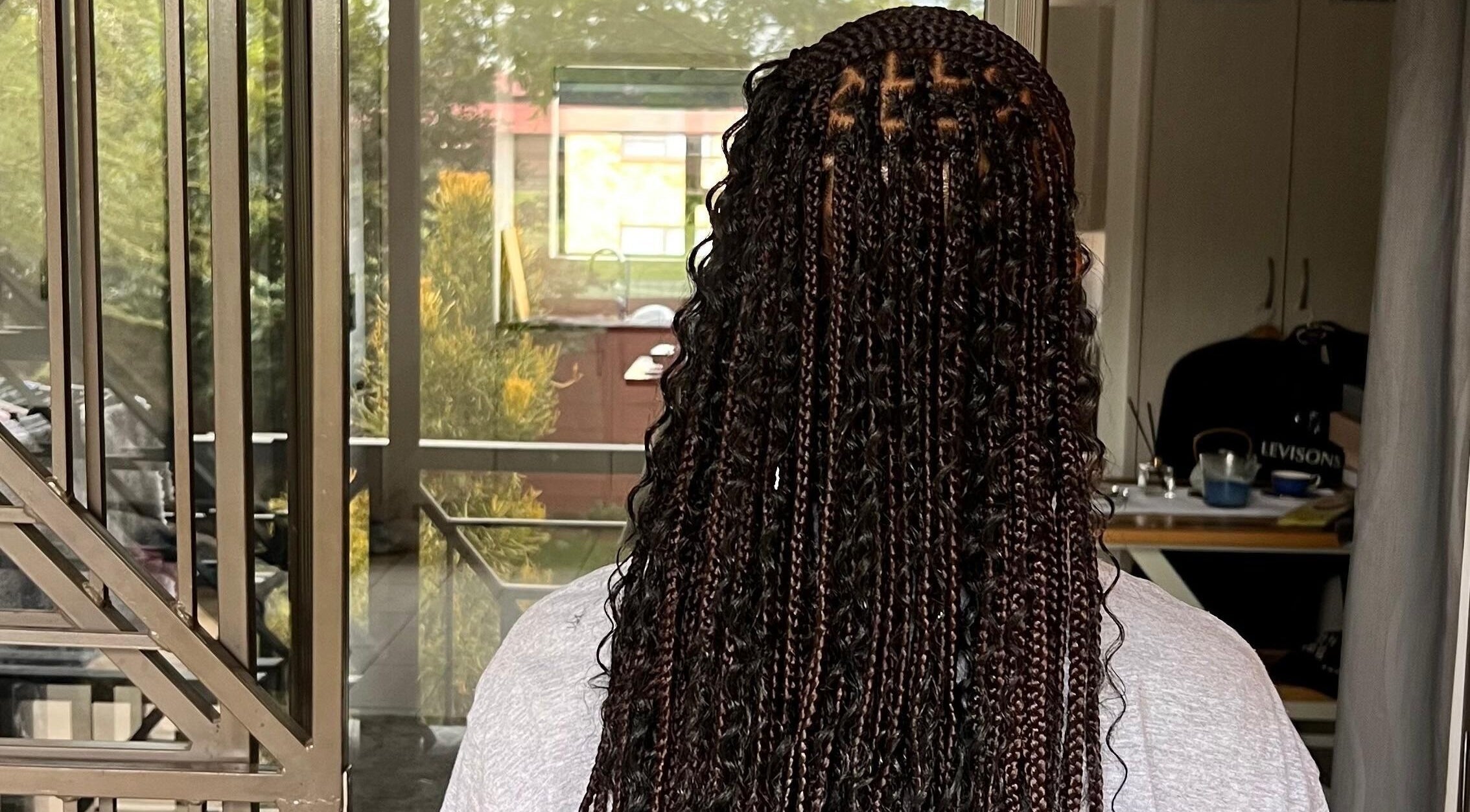 Intricate braided hairstyle at Hairdressers of the North, Roodepoort, Gauteng, ZA.