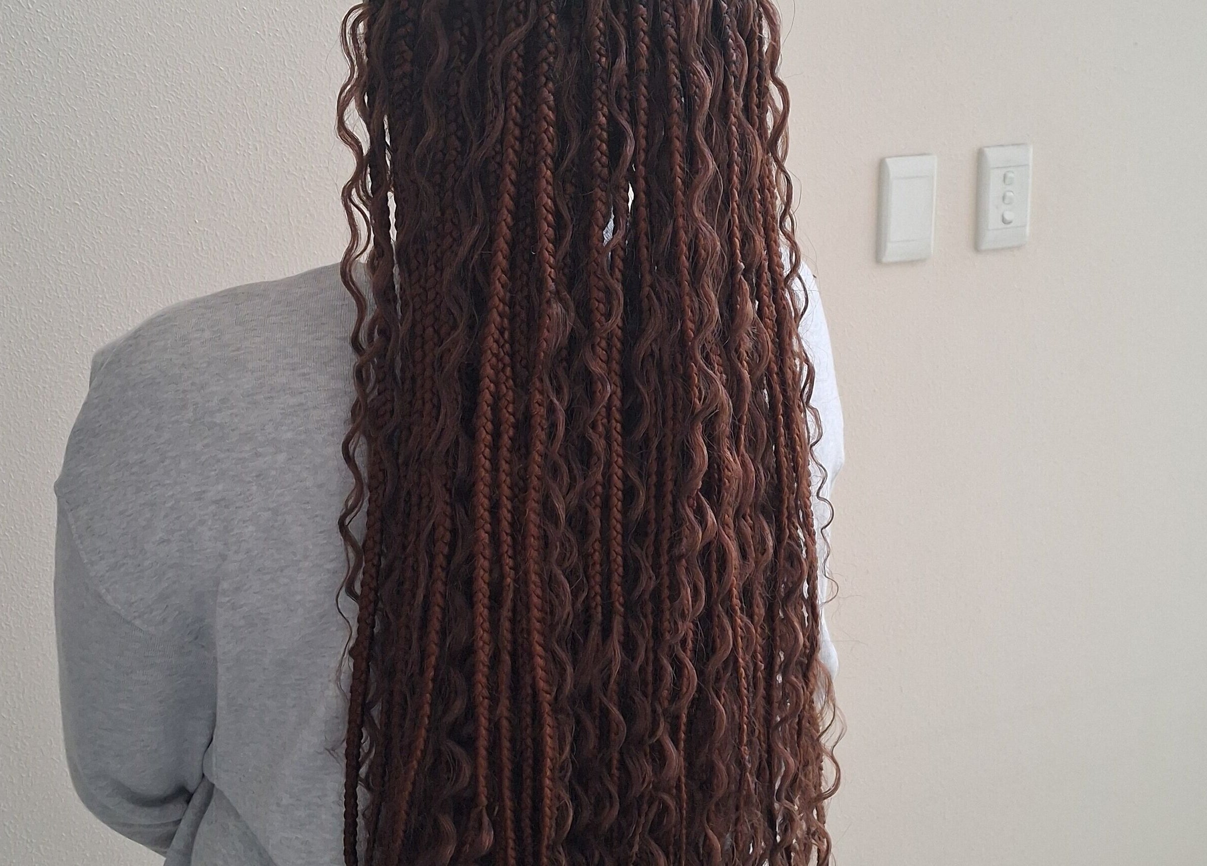 Back view of intricate braids at Hairdressers of the North, Roodepoort, Gauteng, ZA.