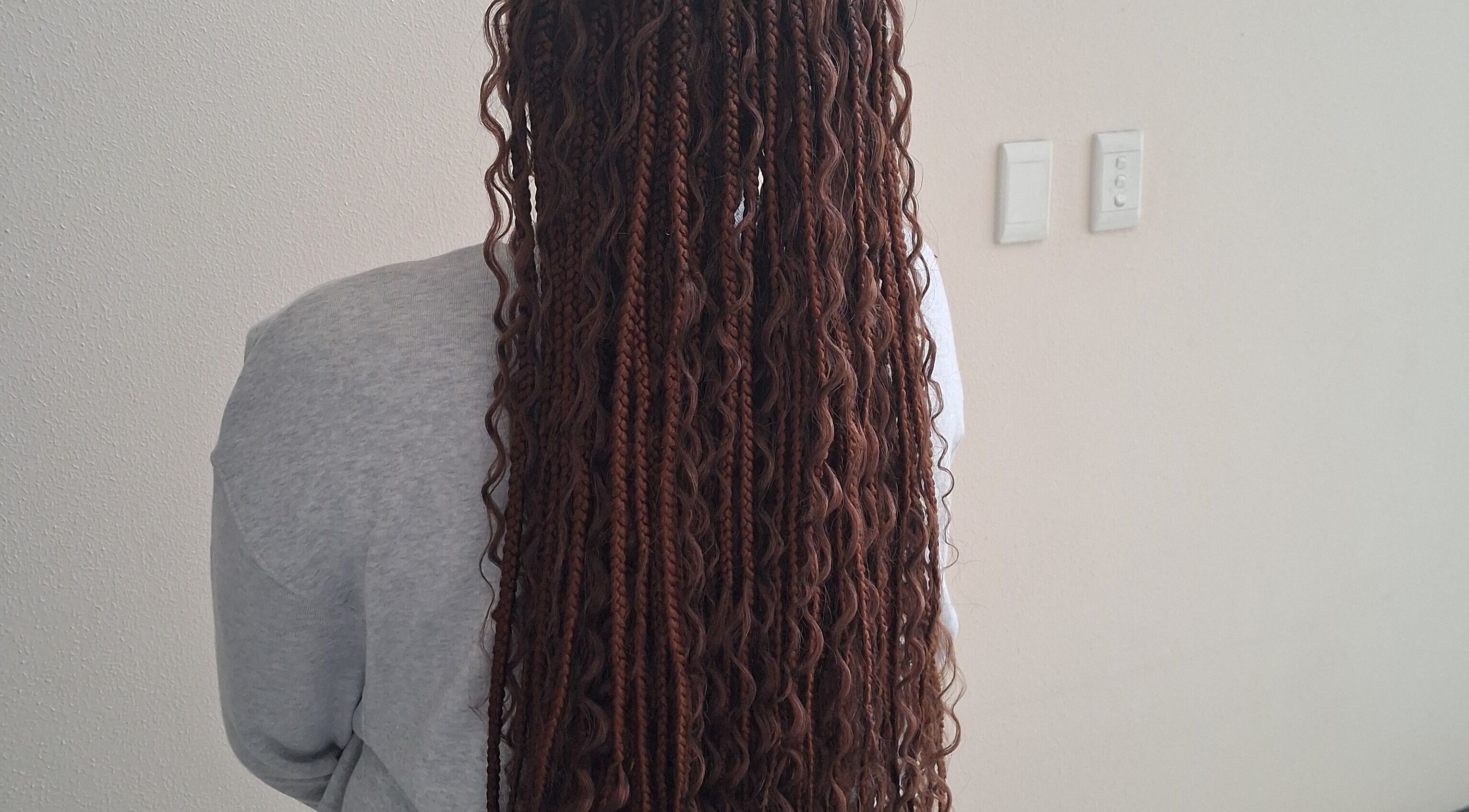 Back view of intricate braids at Hairdressers of the North, Roodepoort, Gauteng, ZA.
