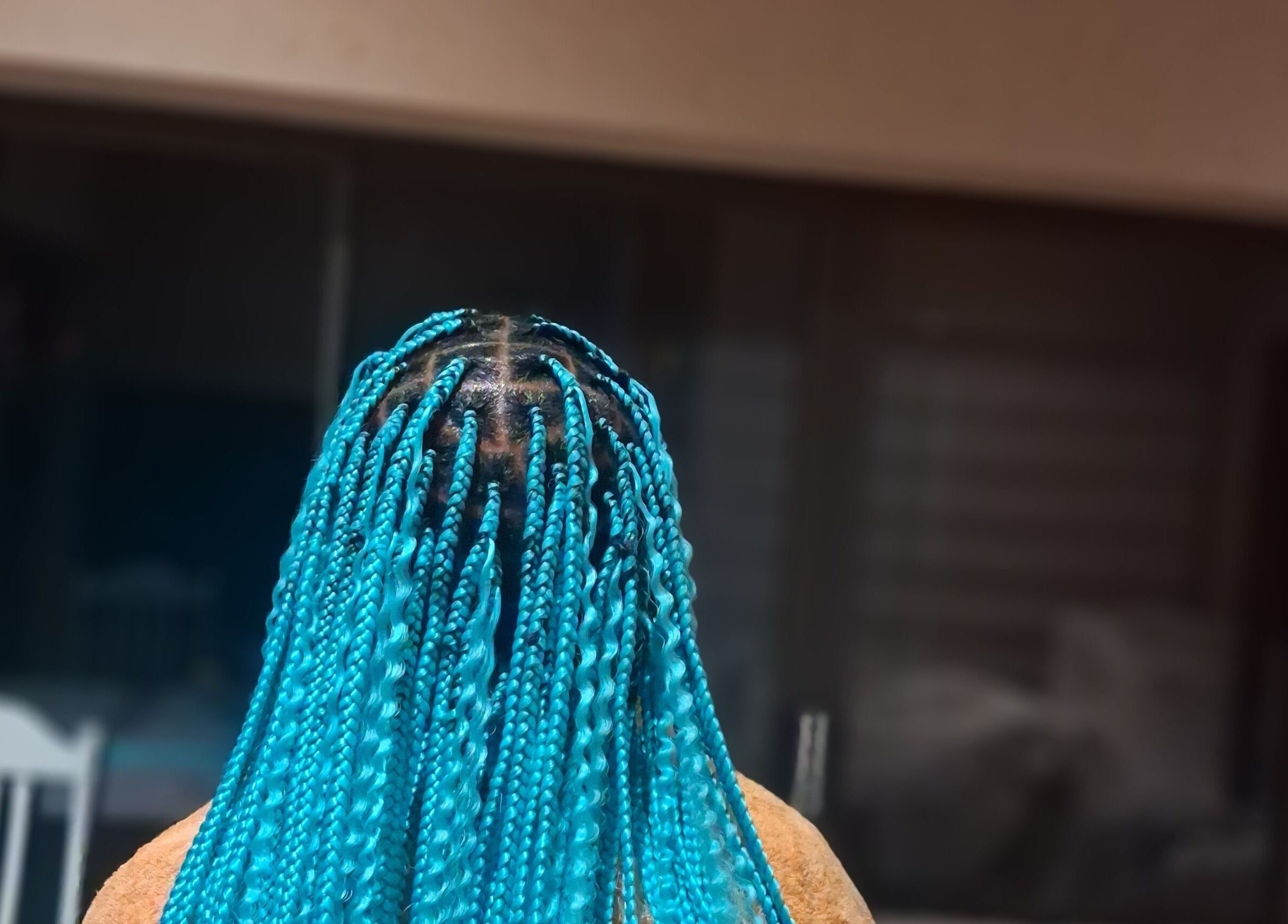Vibrant turquoise braids hairstyle at Hairdressers of the North, Roodepoort, Gauteng, ZA.