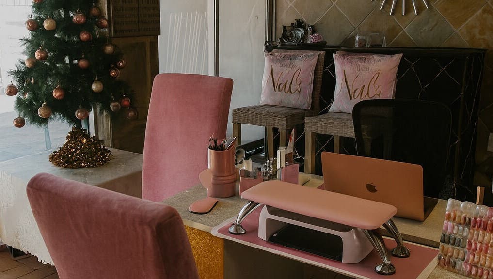 Cozy nail salon interior at Nailsby Demzyn in Cape Town, Western Cape, ZA with festive decor.