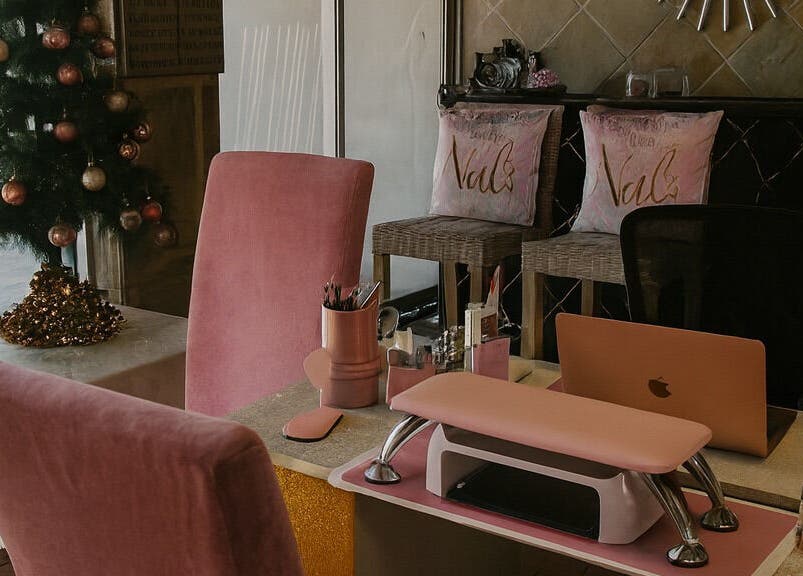 Cozy nail salon interior at Nailsby Demzyn in Cape Town, Western Cape, ZA with festive decor.