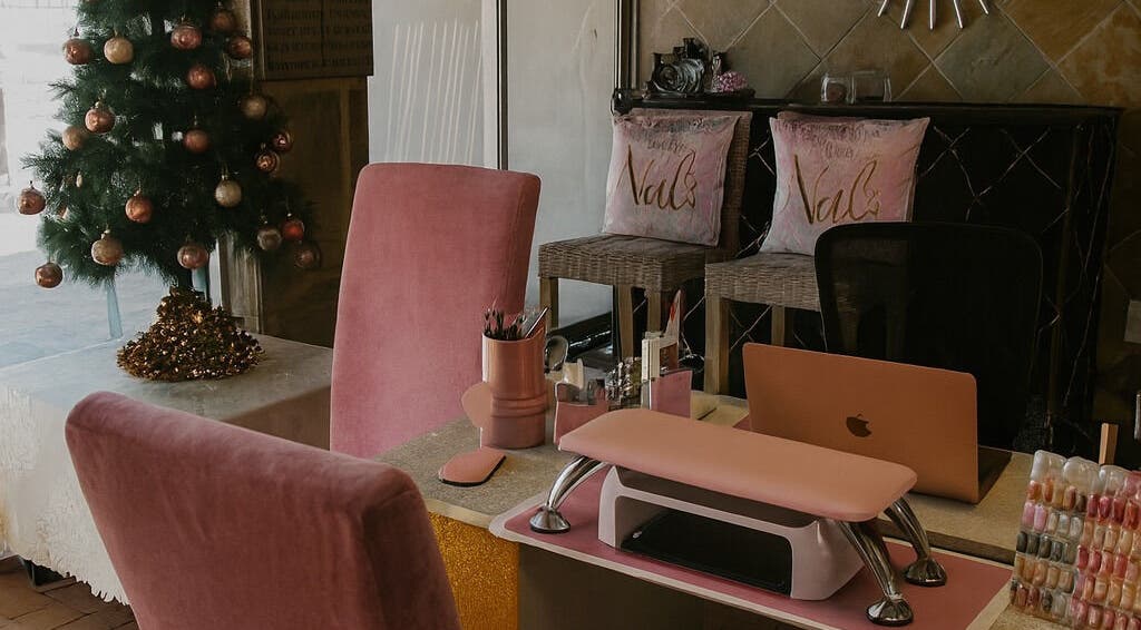 Cozy nail salon interior at Nailsby Demzyn in Cape Town, Western Cape, ZA with festive decor.