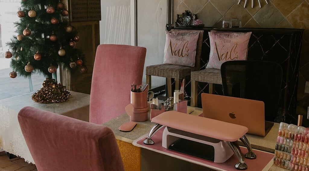 Cozy nail salon interior at Nailsby Demzyn in Cape Town, Western Cape, ZA with festive decor.