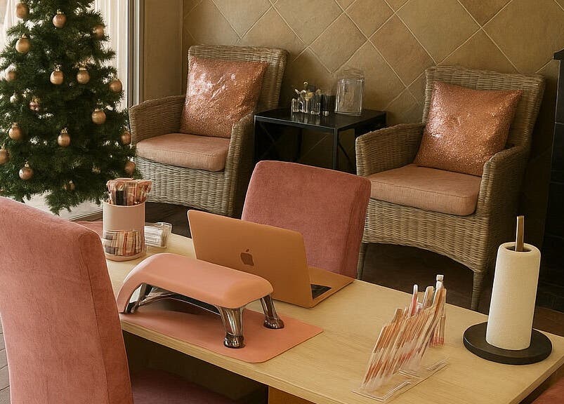 Stylish Christmas décor at Nailsby Demzyn in Cape Town, Western Cape, ZA with cozy seating and nail service area.