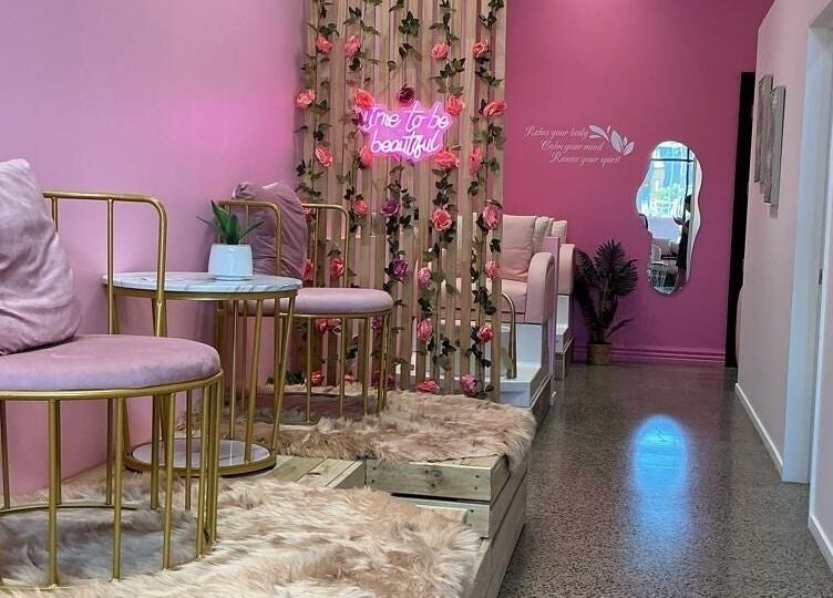 Plush pink seating and floral decor at City Nails & Beauty Studio, Christchurch, Canterbury Region, NZ.