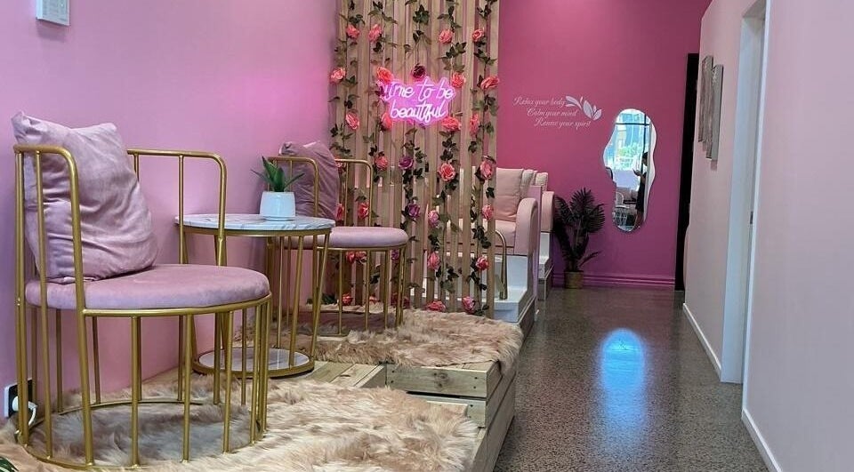 Plush pink seating and floral decor at City Nails & Beauty Studio, Christchurch, Canterbury Region, NZ.