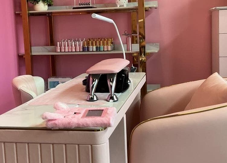 Luxurious nail station at City Nails & Beauty Studio, Christchurch, Canterbury Region, NZ, with plush pink decor.