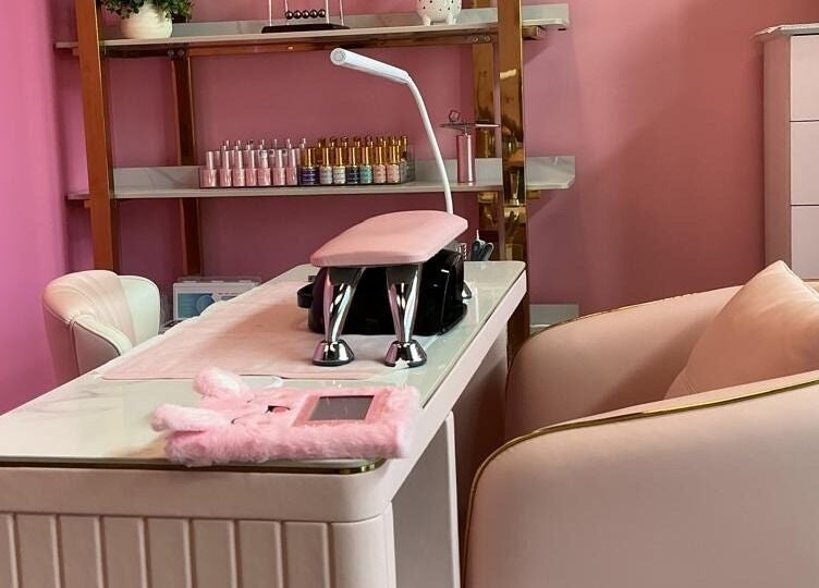 Luxurious nail station at City Nails & Beauty Studio, Christchurch, Canterbury Region, NZ, with plush pink decor.