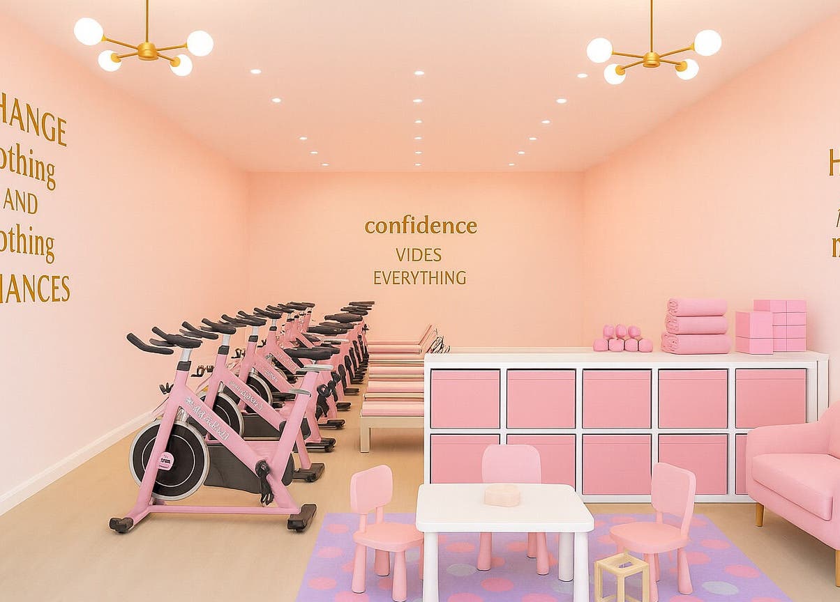 Fabulook Fitness Uk in Royston, England, GB showcases a chic pink indoor cycling space with motivational decor.