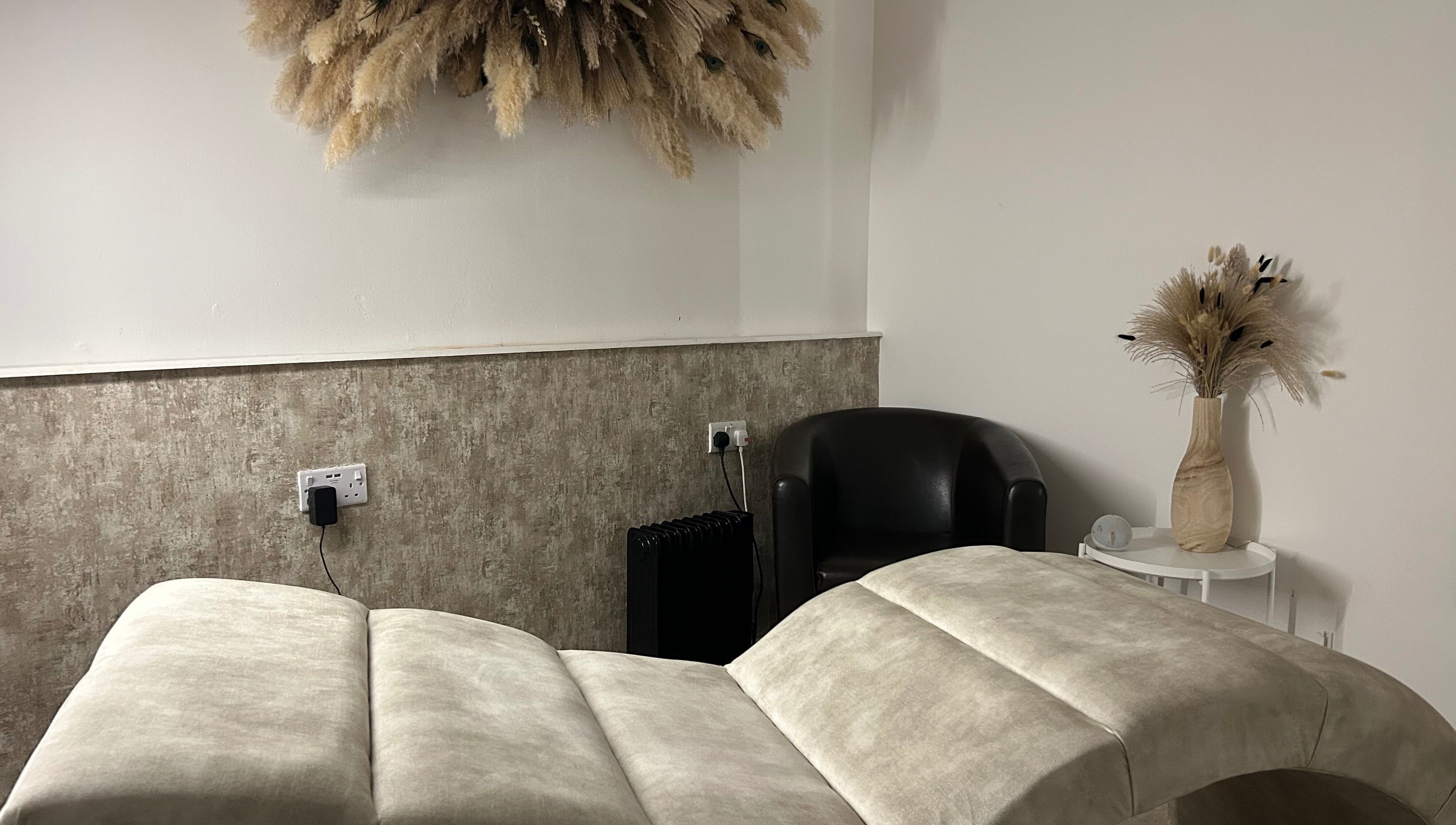 Elegant treatment room at Contourè, Weston-super-mare, England, GB with plush decor and calming ambience.