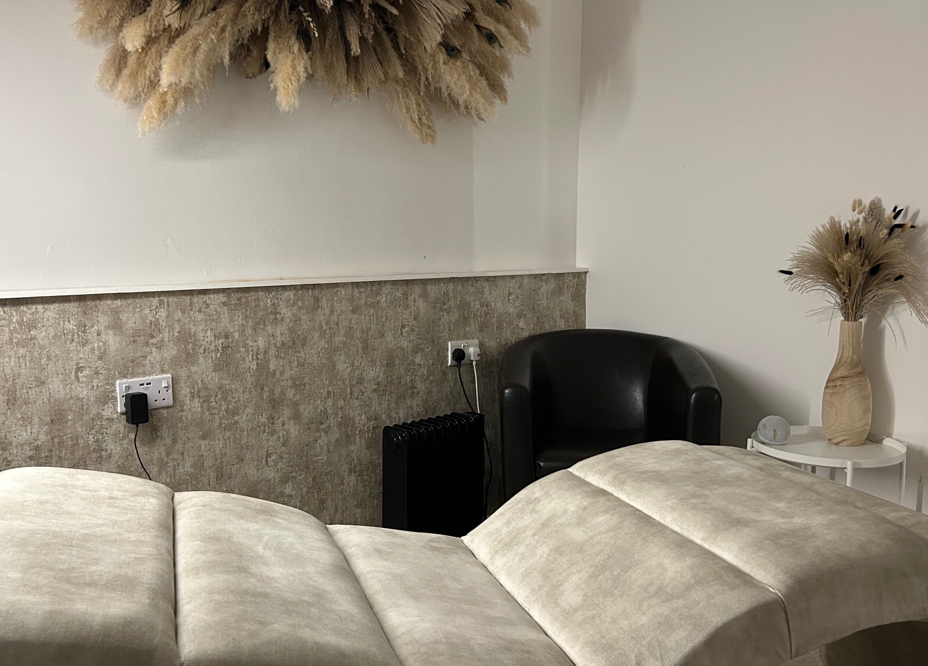 Elegant treatment room at Contourè, Weston-super-mare, England, GB with plush decor and calming ambience.