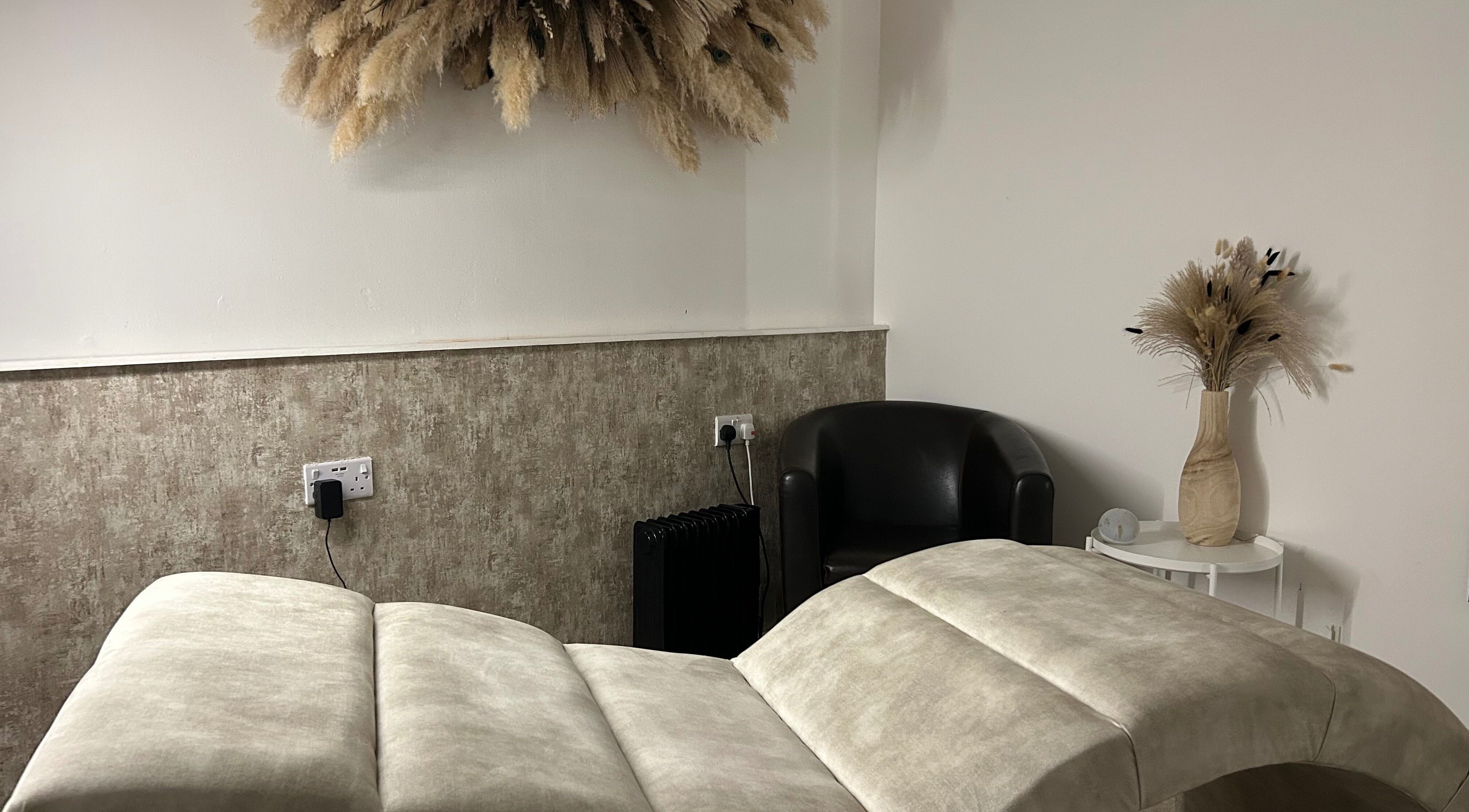 Elegant treatment room at Contourè, Weston-super-mare, England, GB with plush decor and calming ambience.