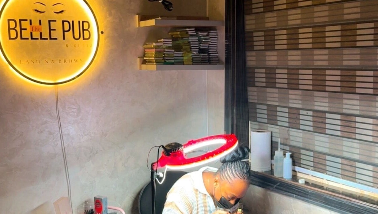 The Belle pub's cozy interior in Gwarinpa, Federal Capital Territory, NG, showcasing beauty services ambiance.