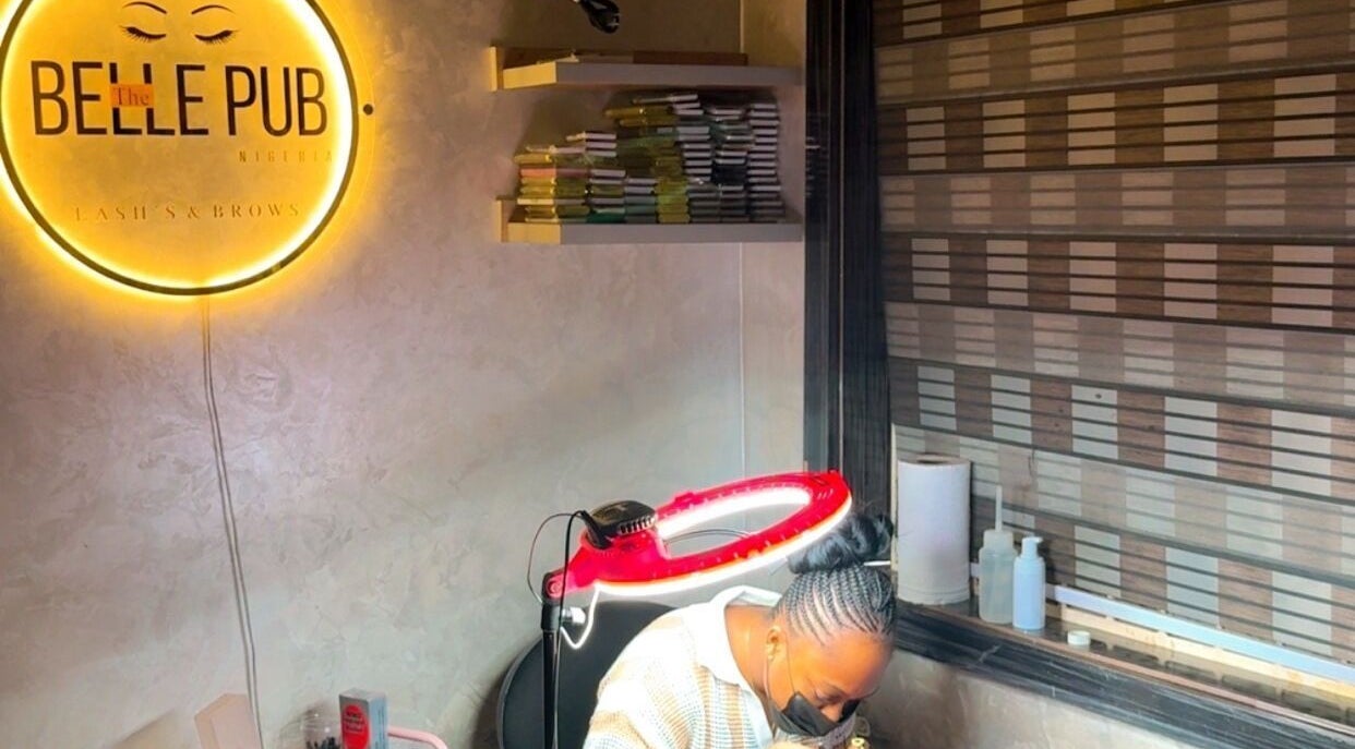 The Belle pub's cozy interior in Gwarinpa, Federal Capital Territory, NG, showcasing beauty services ambiance.