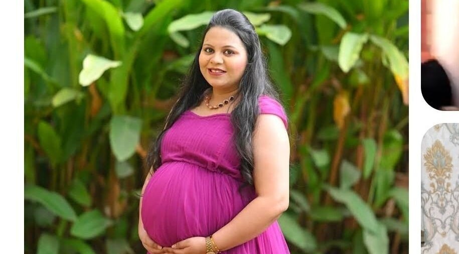 Smiling pregnant woman in pink at Lado's Makeover and Beauty Parlour, Pimpri-Chinchwad, Maharashtra, IN.