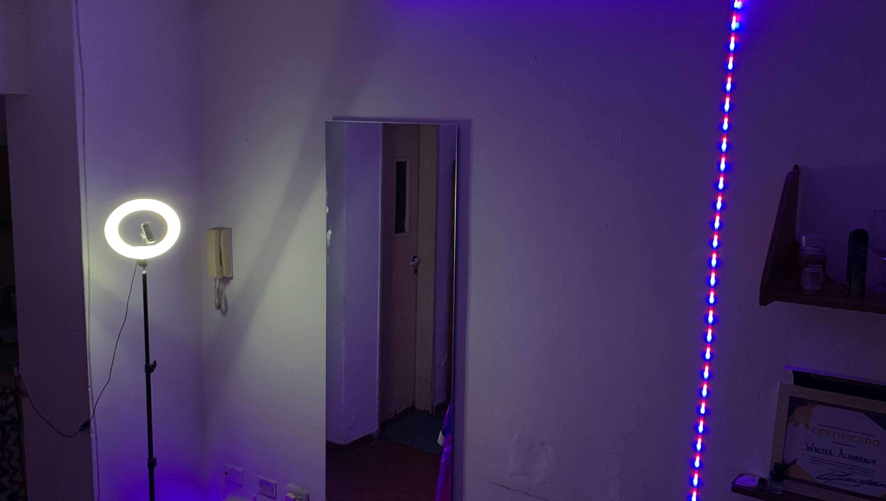 Intimate studio corner at Wal.albarracin, Rosario, Santa Fe, AR with vibrant LED and ring light setup.