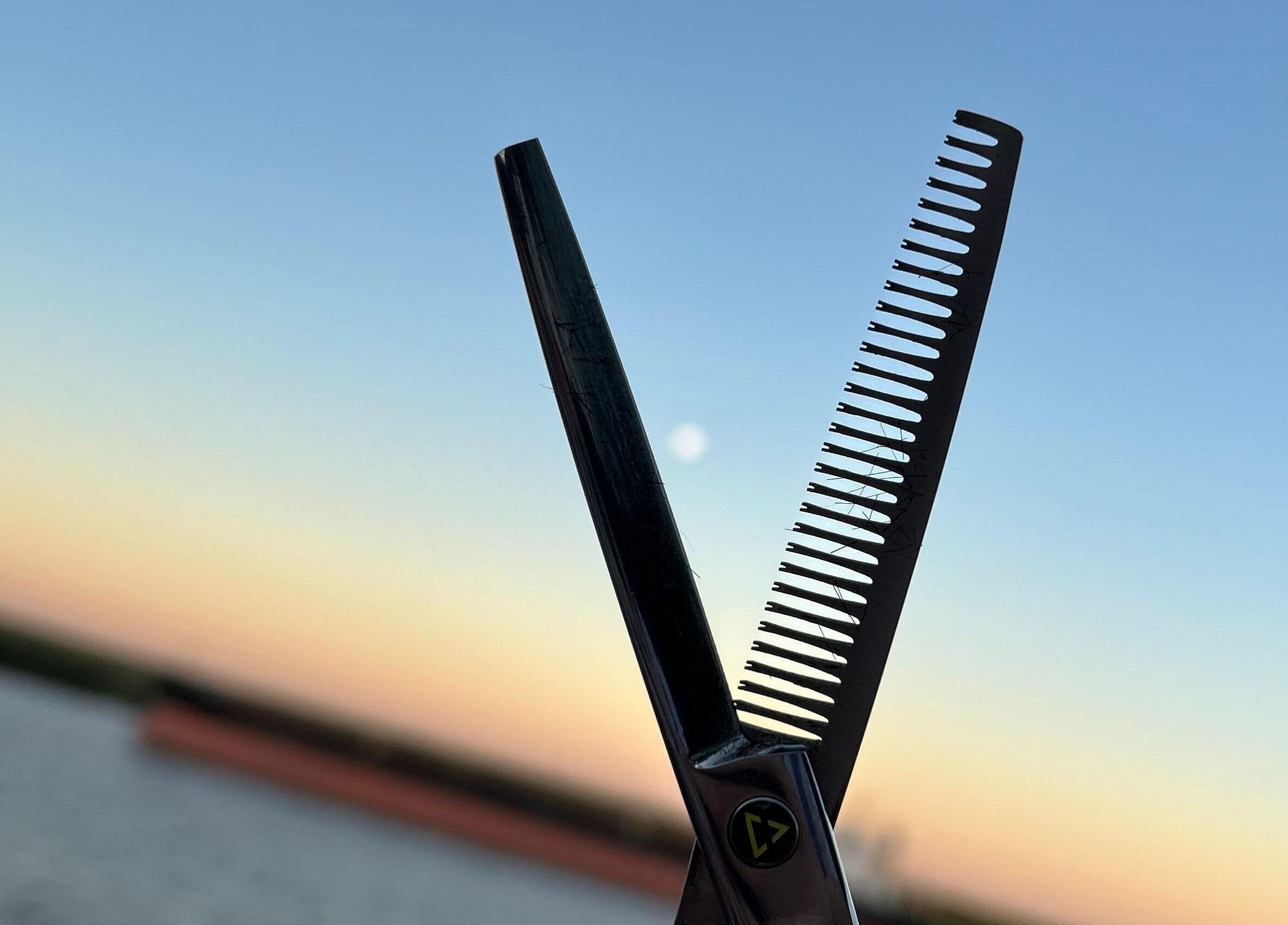 Scissors and comb silhouette at sunset, Wal.albarracin, Rosario, Santa Fe, AR.