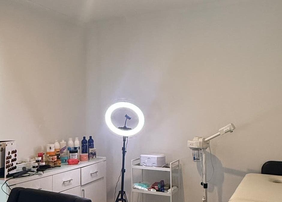 Spa treatment room at Strand & Style Beauty Lounge in Melbourne, Victoria, AU with a bed and equipment.