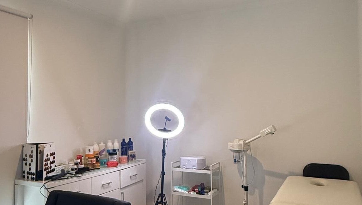 Interior of Strand & Style Beauty Lounge in Melbourne, Victoria, AU showcasing a serene treatment room.