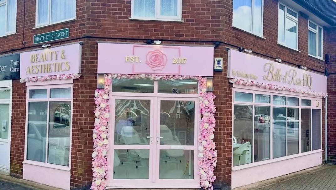 Pink and white floral facade of casiejeanlashes in Birmingham, England, GB. Inviting entrance to beauty venue.