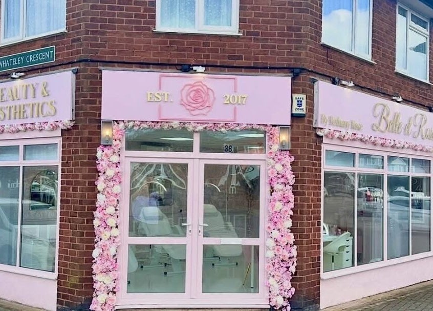 Pink and white floral facade of casiejeanlashes in Birmingham, England, GB. Inviting entrance to beauty venue.