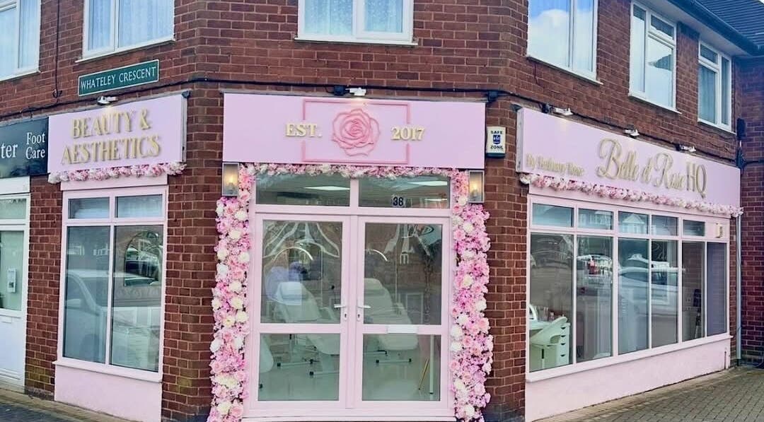 Pink and white floral facade of casiejeanlashes in Birmingham, England, GB. Inviting entrance to beauty venue.