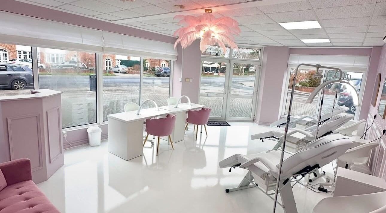 Elegant interior of casiejeanlashes in Birmingham, England, GB, featuring plush seating and modern styling stations.