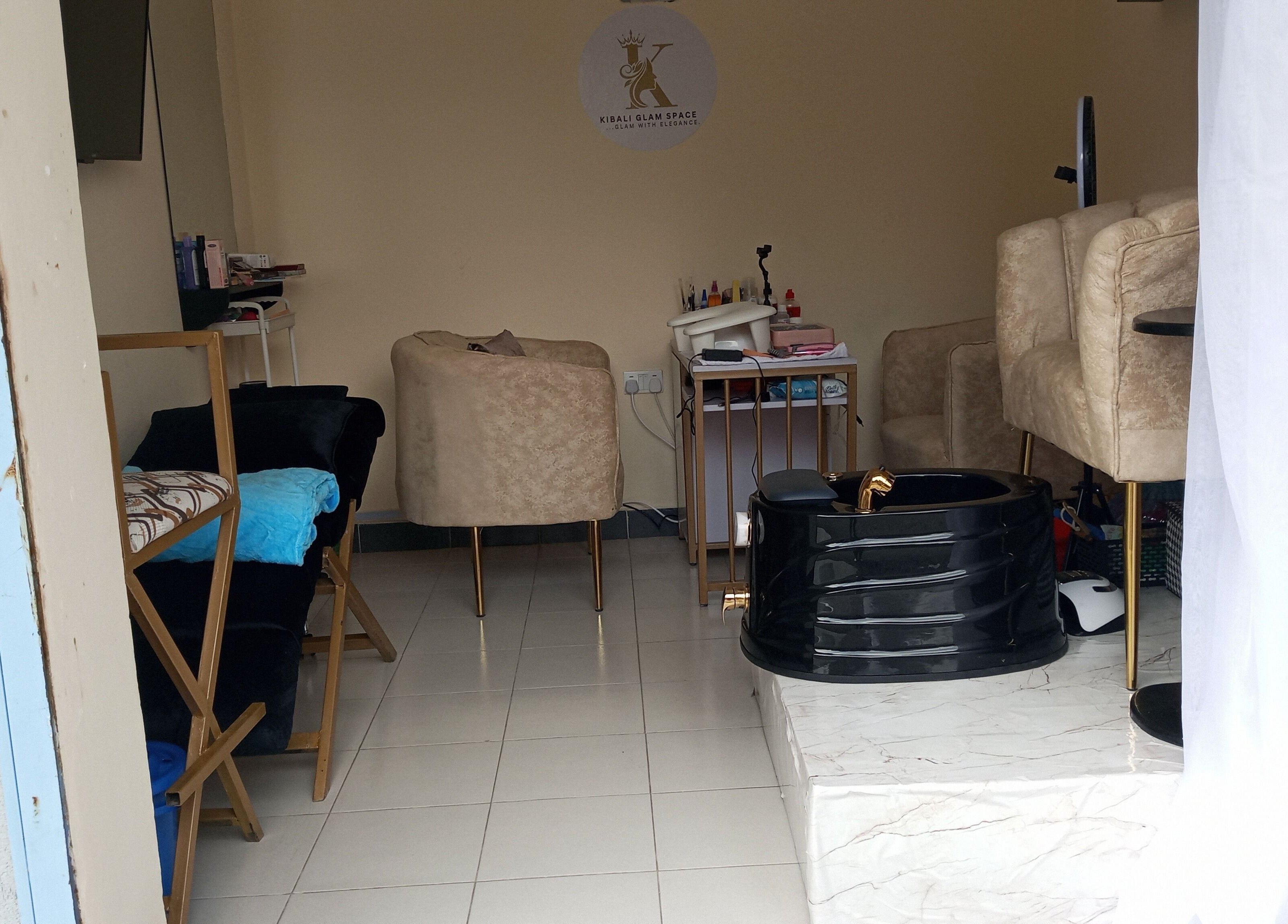 Elegant interior of Kibali Glam Space in Nairobi, Nairobi County, KE with plush seating and modern decor.