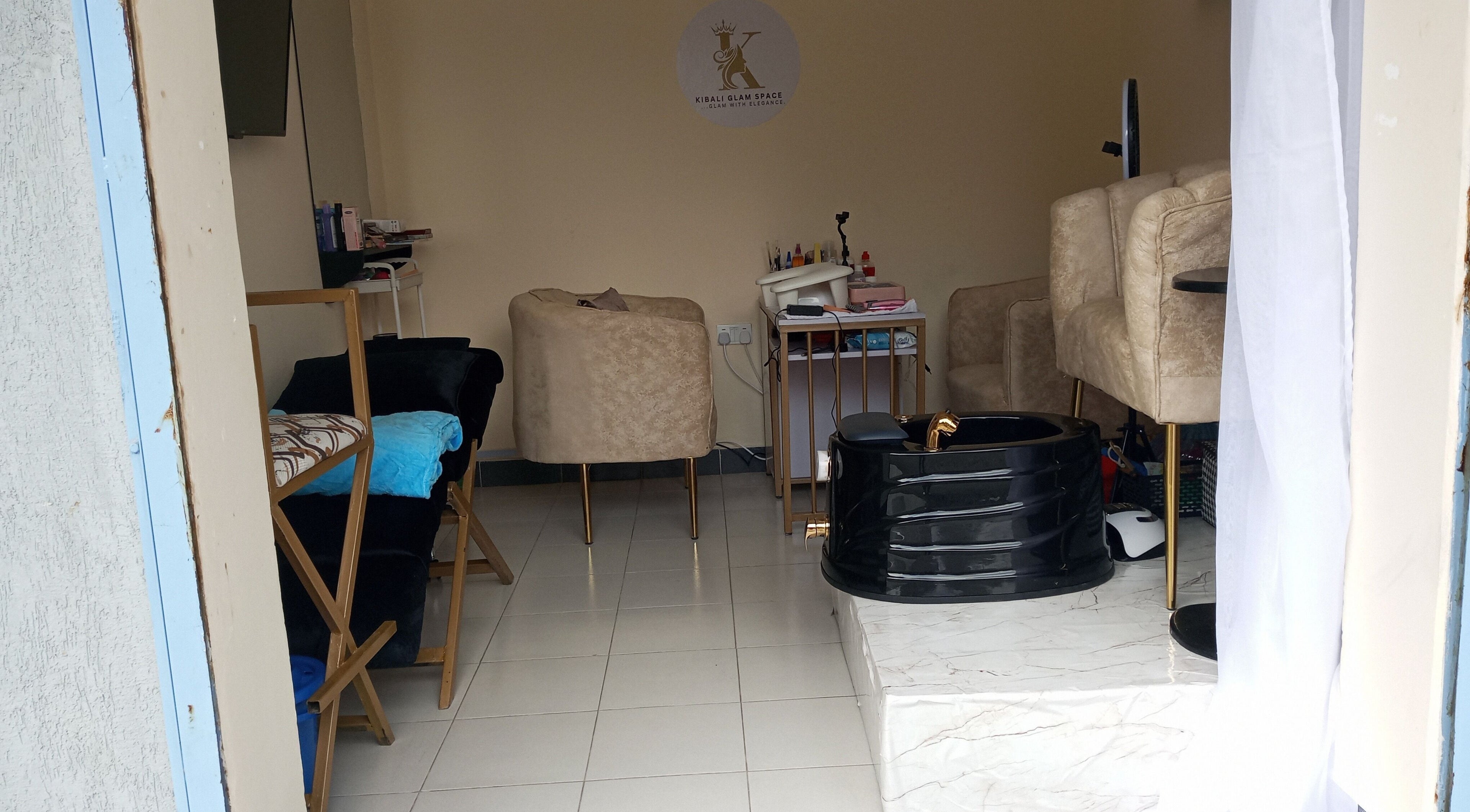 Elegant interior of Kibali Glam Space in Nairobi, Nairobi County, KE with plush seating and modern decor.