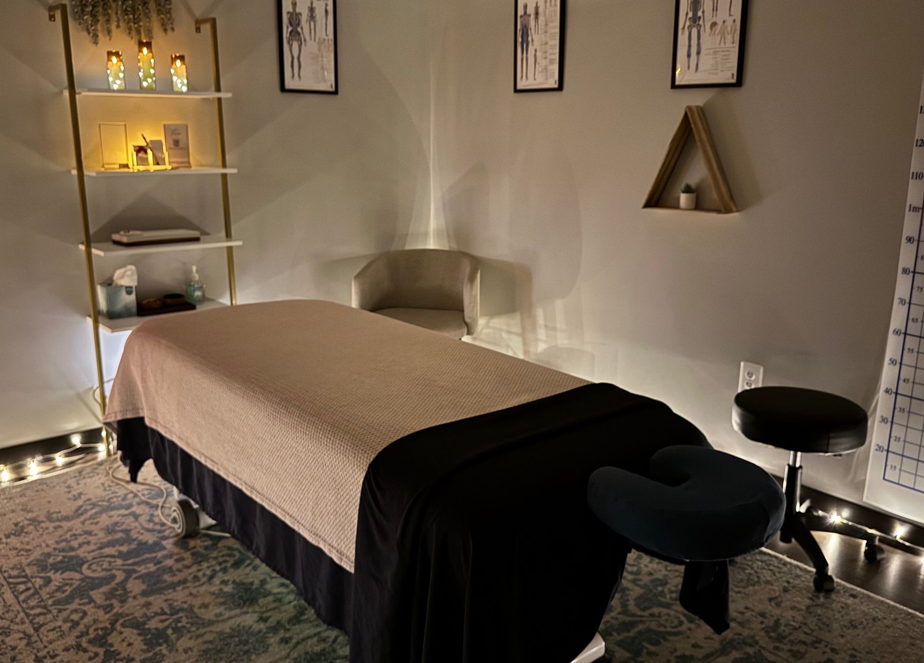 Tranquil massage room at StillPoint Massage & Bodywork in Leesburg, Virginia, US with calming lights and cozy decor.