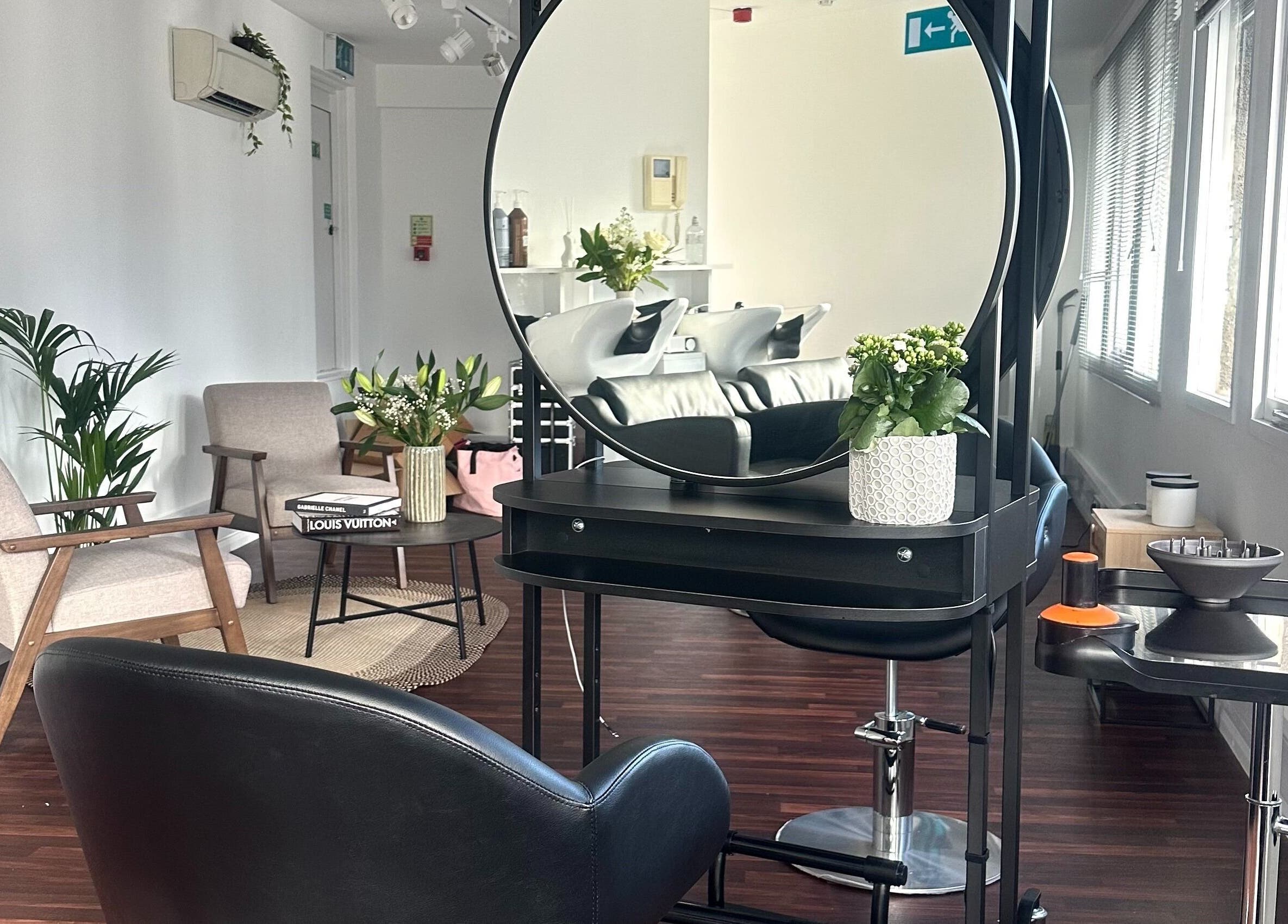 Elegant interior of Zoey Olechnowicz Hair Colourist in London, England, GB featuring stylish chairs and modern decor.