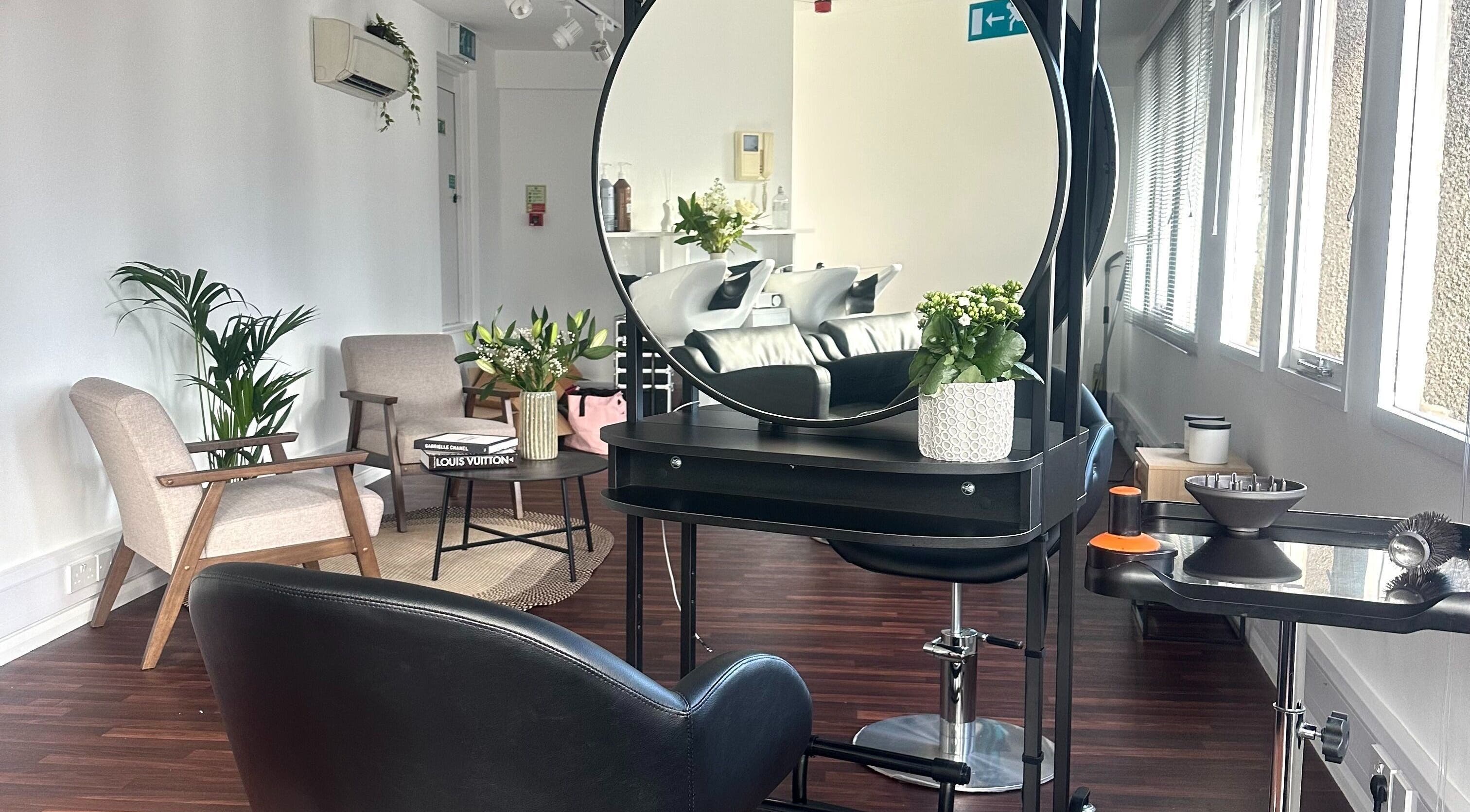 Elegant interior of Zoey Olechnowicz Hair Colourist in London, England, GB featuring stylish chairs and modern decor.