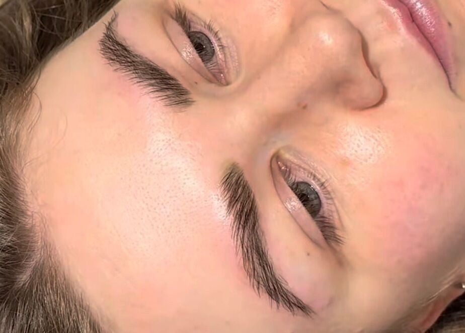 Close-up of a woman’s relaxed face with groomed eyebrows at Doe of the Dales, Alfreton, England, GB.