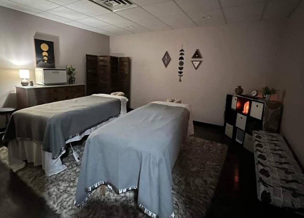 Relaxing treatment room at Golden Grace Wellness Spa in Warwick, Rhode Island, US with two massage tables.