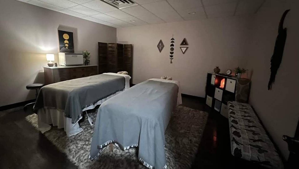 Relaxing massage room at Golden Grace Wellness Spa, Warwick, Rhode Island, US with two therapy tables.