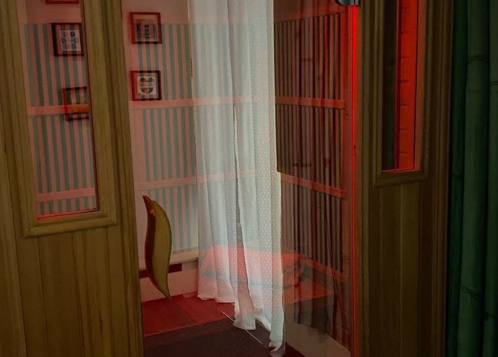 Intimate relaxation room at Golden Grace Wellness Spa, Warwick, Rhode Island, US, featuring soft lighting and cozy design.