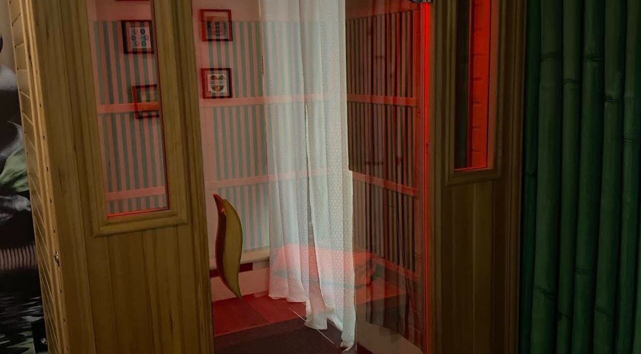 Intimate relaxation room at Golden Grace Wellness Spa, Warwick, Rhode Island, US, featuring soft lighting and cozy design.