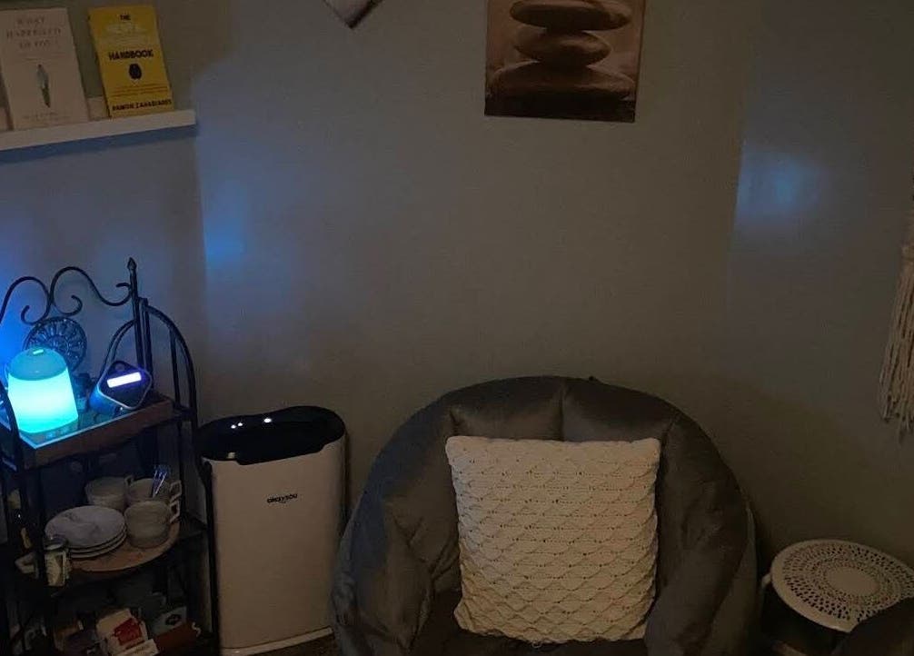 Cozy relaxation corner at Golden Grace Wellness Spa, Warwick, Rhode Island, US with ambient blue lighting.