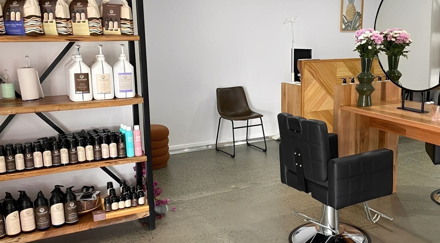 Modern salon interior of Curly & Co Hair in Tweed Heads, New South Wales, AU with stylish products.