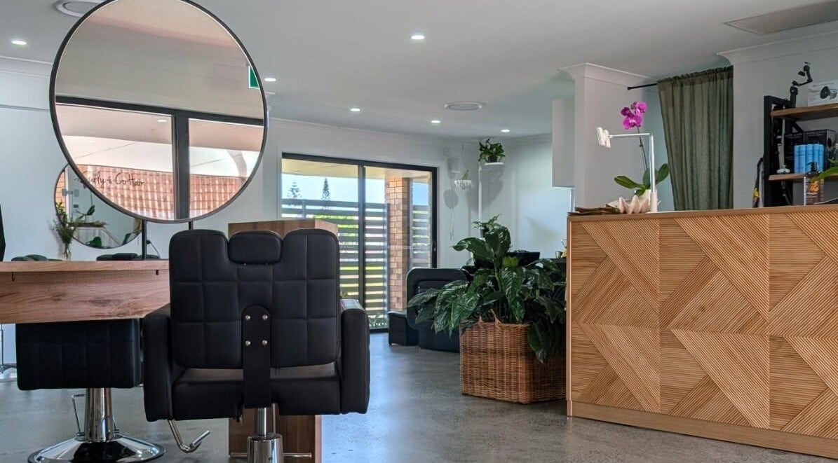 Modern salon interior with chic decor at Curly & Co Hair, Tweed Heads, New South Wales, AU.